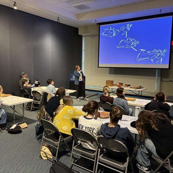 Katy Menne presents a maritime history talk to a group of middle schoolers